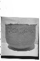 Large incised urn with 3 vents in bottom