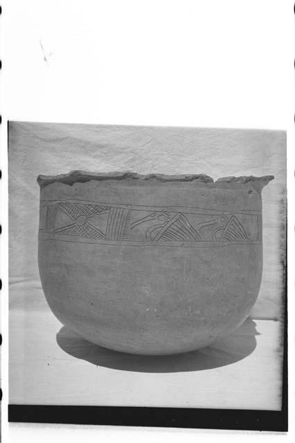 Large incised urn with 3 vents in bottom