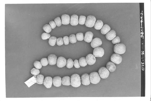 String of jade beads (40) A-1-212-Tomb III. D. of largest beads 1.5 cm.