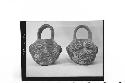 Two small plumbate vessels with loop, basket handles, cat.# 43-9-147, 148, and T