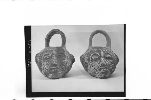 Two small plumbate vessels with loop, basket handles, cat.# 43-9-147, 148, and T