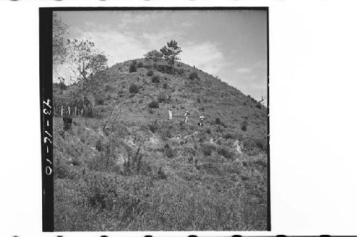 Men at base of southwest corner of largest mound