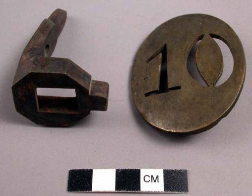 Tools, metal, one oval with stenciled number "10", one unidentified fitting