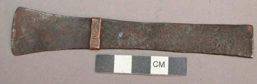Flat almost rectangular knife (one end flared) with a small copper band around i