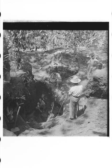 Laborers excavating pottery cache