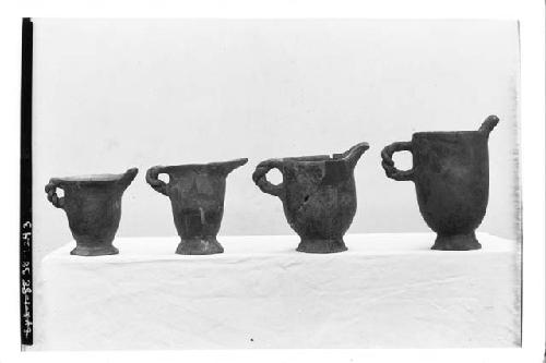 4 cream pitchers ( twisted handles) A-1-528, A-1-583, A2-42. H 573-15.5