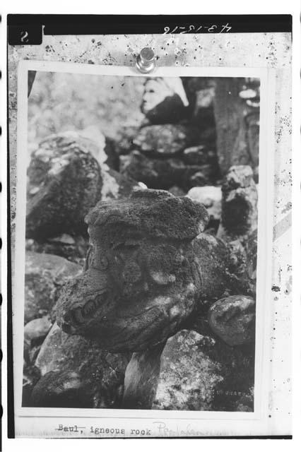 Tenoned sculptures of head of Ehecatl monster.