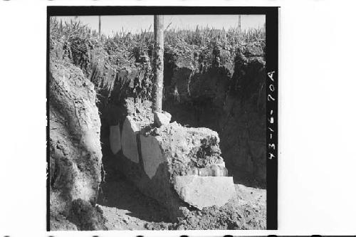 N side and W. end of tomb during (A) and after (B) excavation.  View to SE.  In