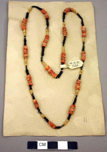 Necklace - silver, black stone, coral and yellow shell beads