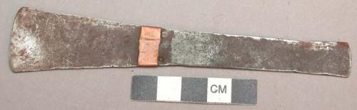 Flat almost rectangular knife (one end flared) with a small copper (?) band arou