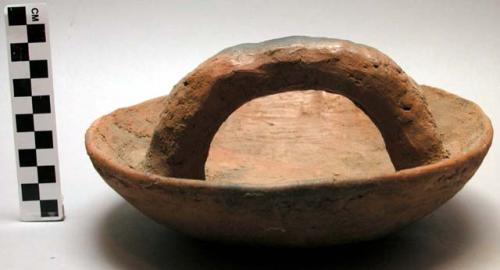 Pottery pot cover with handle.  Urubiga