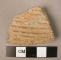 Potsherd - combed or impressed ware, straw tempered