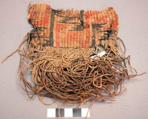 Portion of turned woven breech clout probably made of yucca fibre; much string a