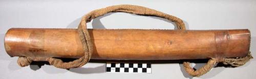 Cylindrical shaped leather quiver with a flat base and a cloth strap