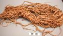 Organic bark strands folded over twisted fiber cordage