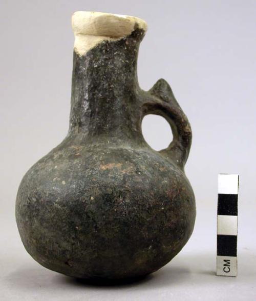 Single-handled, long, thin neck pottery jug