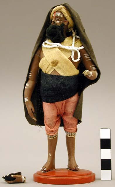 Figurine, male, hindu beggar, left hand broken off but present