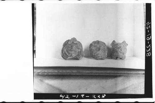 Plumbate fragments, 2 human head (1 in bird's bill) and jaguar head.