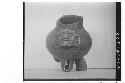 Plumbate standard jar, tripod, human head appliqued;