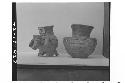 Plumbate miniature animal effigy and miniture standard jar, incised medallion