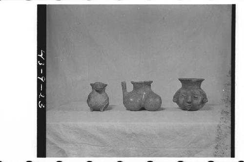 Left- Small reddish orange ware effigy pitcher (see 43-9-22, 24)/ C- orange brow