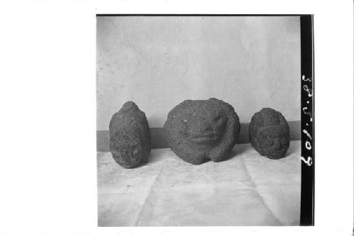 Three stone figures (animal). (Front)
