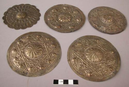 Brass discs, ornamented