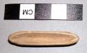 Small wooden boat-shaped object, in witch doctor's basket 39-64-50/3459.
