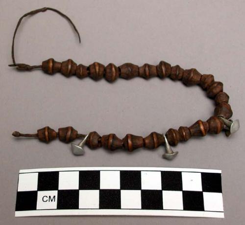 String, leather, of wooden beads and four metal beads