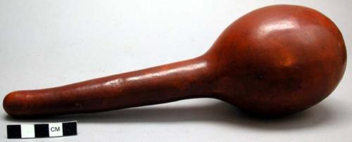 Polished brown-red gourd rattle