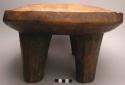 Ceremonial wooden four-legged stool with carved decoration