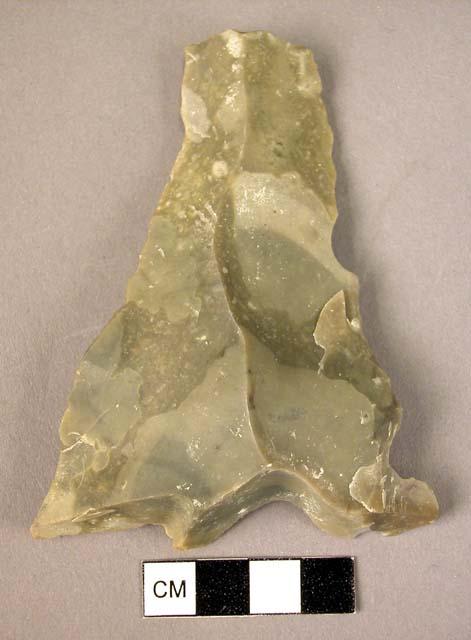 Long flint blade with expanding sides & broad straight end