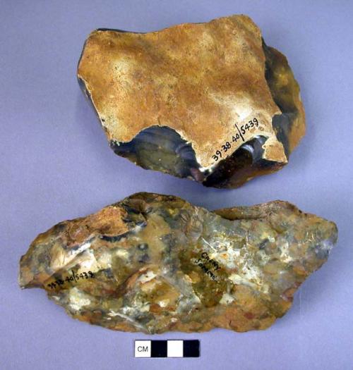 2 large, long, single-edged flint cores or unfinished hand axes ?