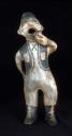 Male figurine. One hand in pocket; the other holding cup. 39x15x15 cm.