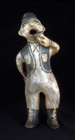 Male figurine. One hand in pocket; the other holding cup. 39x15x15 cm.