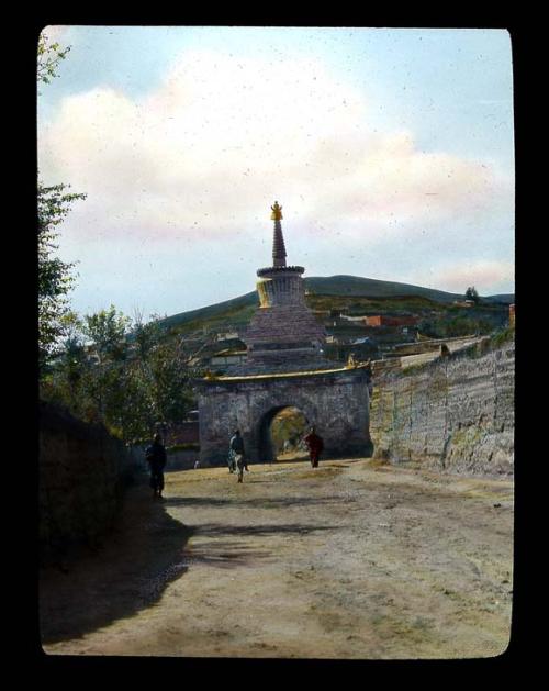 Lantern slide of stone gateway, hand-colored