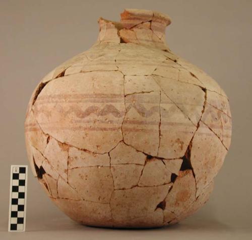 Ceramic jar, spherical, flaring rim, red on buff geom. des., broken, mended