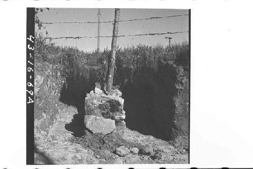 W. end and part of S. side of Tomb during excavation.  In B, plumbate jar can be