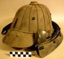 Helmet, ridged, visor, riveted, tiered neck protector, perforated, fiber tie