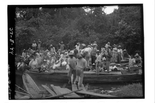 Boats loaded with freight and passengers a