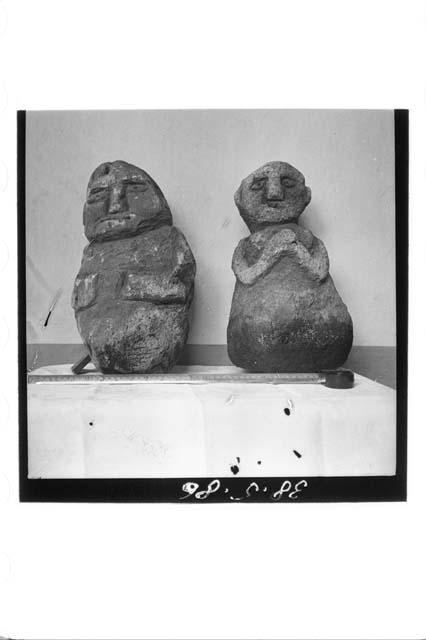 Two Stone Figures seen from the Front