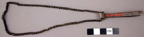Iron tweezers on brass chain (beard remover)