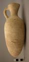 Long pointed pottery juglet - pinch-mouth; cream slip;