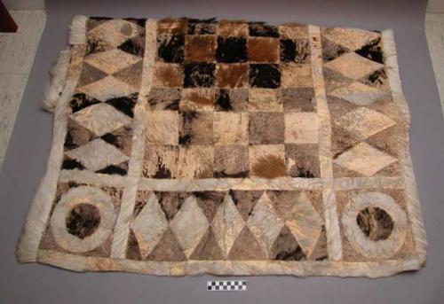 Rug of white, black and brown horse hair skin