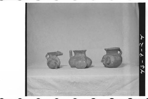 Left- ditto as in 43-9-22 (Left -Small reddish orange effigy pitcher/ Lt. C.- Re