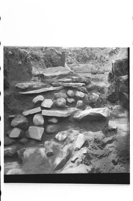 Stone construction in fill of mound