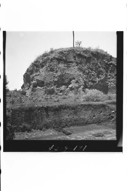 South mound partly cut away for adobe material.