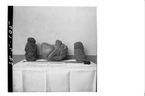 Three crude stone figures (Right profile).