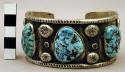 Cuff bracelet, silver band with stamped dec. and inlaid turquoise nuggets