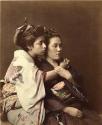 Two young Japanese women in traditional dress, European pose